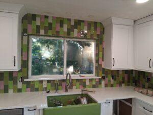 Louise designed the backsplash. Window is doubled in size.